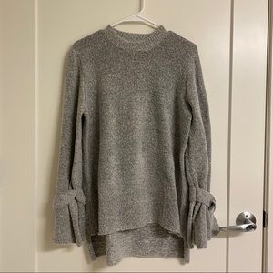 Gray sweater with tie wrist.